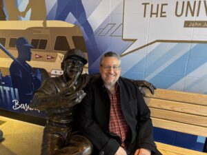 Posing with a Buck O'Neil statue